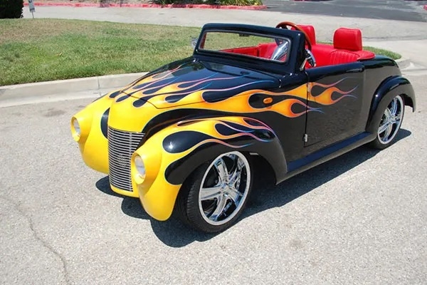 Black 39 Roadster with Yellow Flames affordable golf cart rental, golf cart rent irving golf cart rental