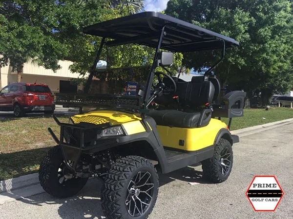 Yellow Aluma 4 Passenger Lifted Golf Cart affordable golf cart rental, golf cart rent irving golf cart rental